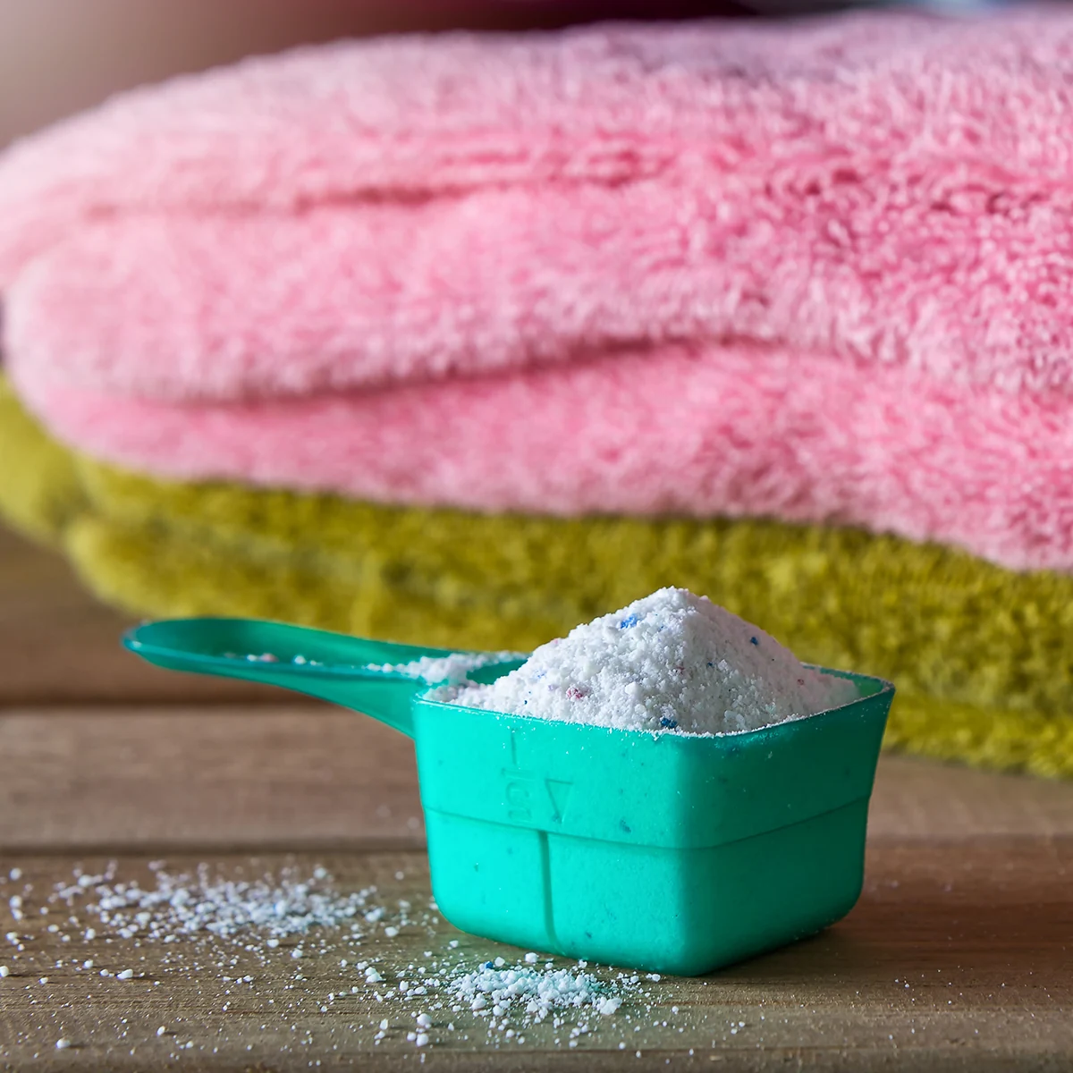 Powdered soap in a dispenser next to towels